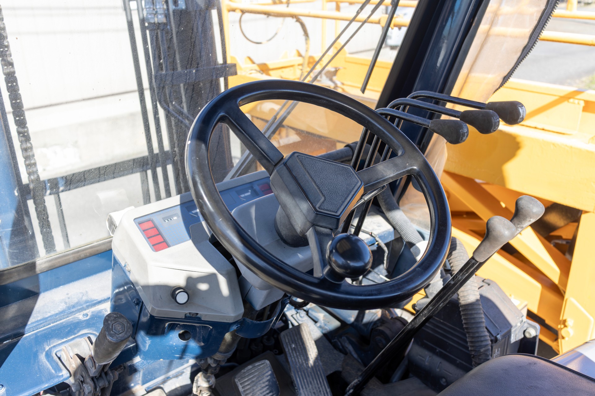 Image of the driver's seat of a backhoe